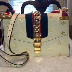 Gucci Cream Slyvie with Gold Bee & Star Accents and Red-Blue Web Handle
